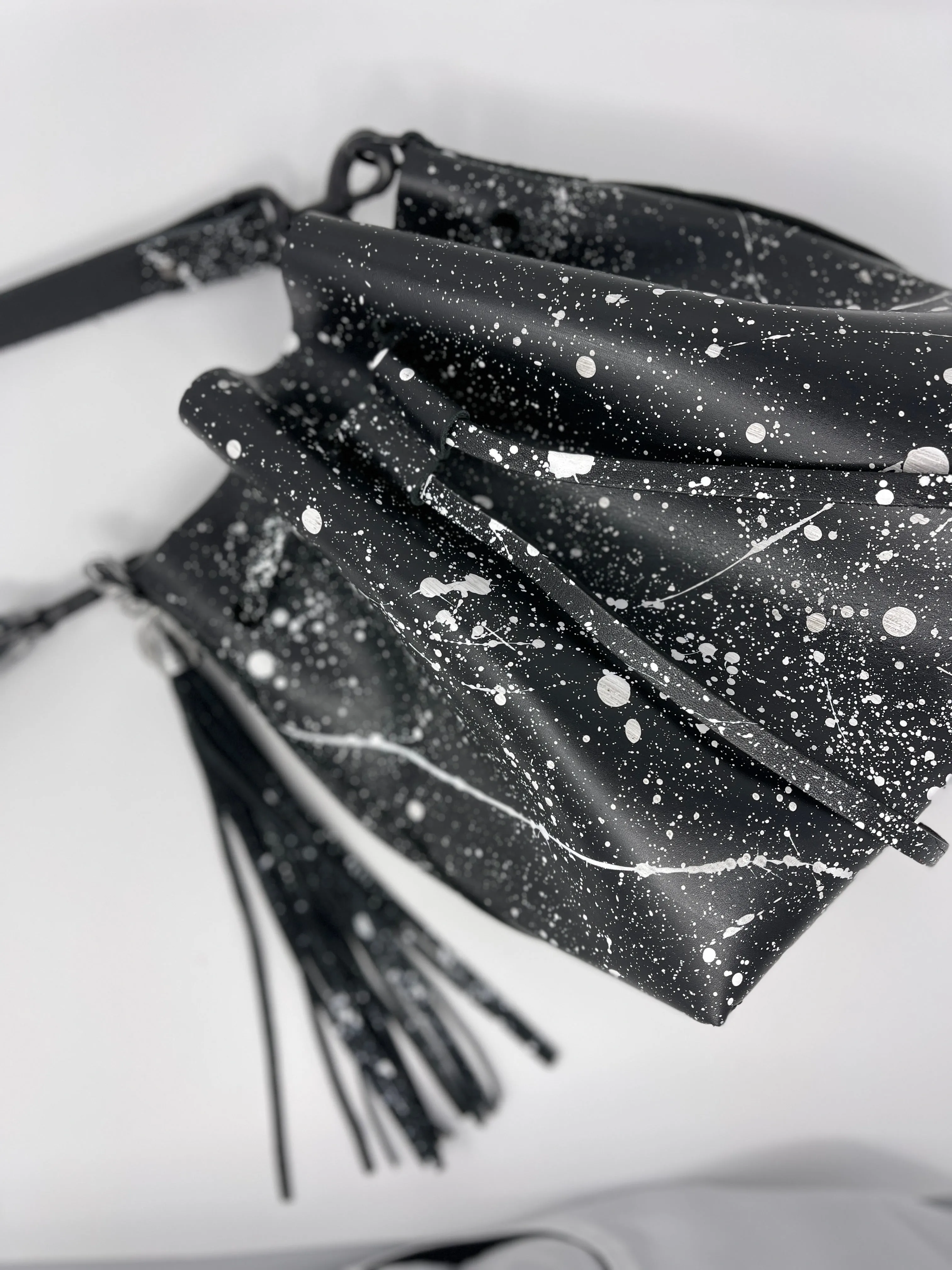 Black Leather Drawstring Bucket Shoulder Bag With Matte White Splatter